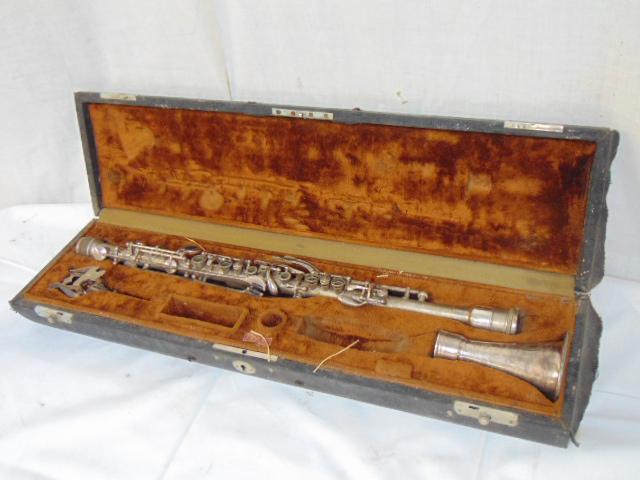 Harry Pedler & Co clarinet in case, silver toned flute: Harry Pedler & Co clarinet in case, silver toned flute in case by Harry Pedler & Company, Elkhurst, Indiana.