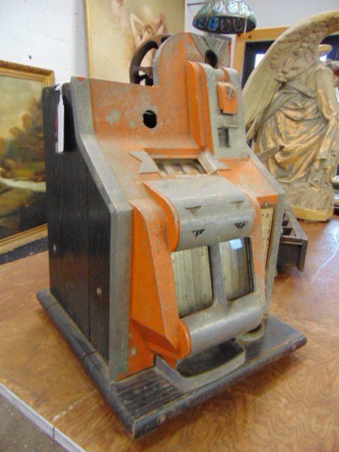 Vintage slot machine, no make: Slot machine or one armed bandit, as found, aluminum case , worn paint, could not find a make, sold as found, needs restoration, 12.5" by 13.75" (base), height is 18.75"