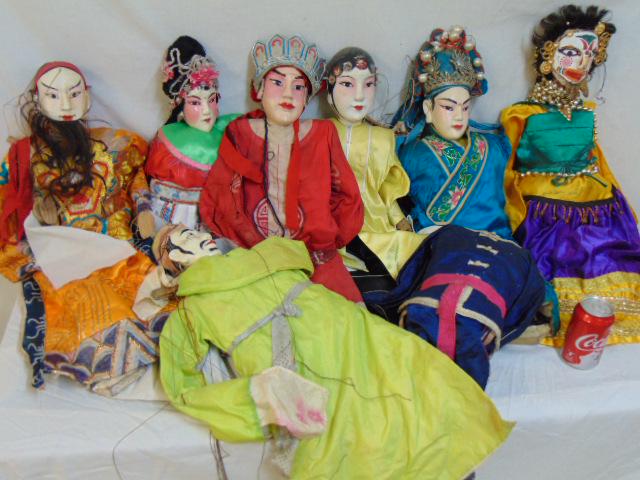 7 Chinese marionette puppets, carved wood & painted: 7 Chinese marionette puppets, carved wood & painted heads, all with Chinese clothing, comes with one extra body.