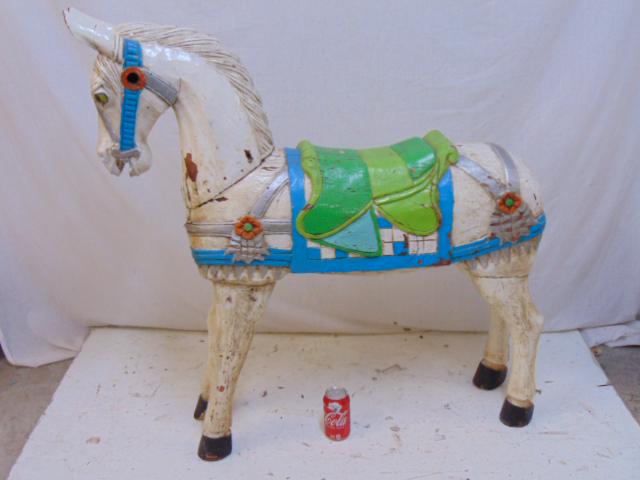 Carved wood paint decorated horse, pony, white with: Carved wood paint decorated horse, pony, white with green saddle, horse is 38" long, 9" wide, height is 40.25" tall, glass eyes, tail missing.