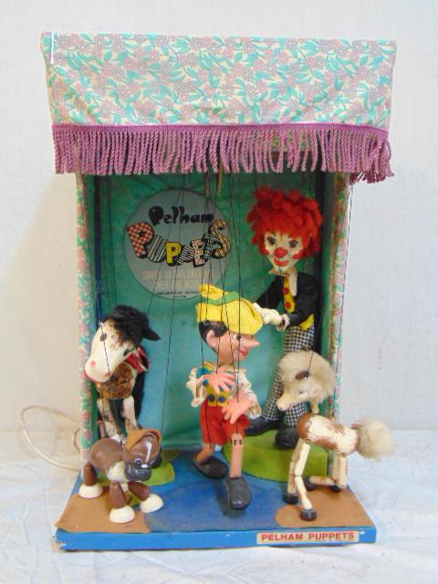 Pelham puppet theater with Pinocchio, horse, theater is: Pelham puppet theater with Pinocchio, horse, theater is 14" by 10", height is 21.5"