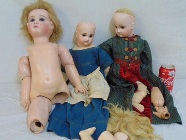 Bisque doll lot, 3 dolls, Jumeau & German: Bisque doll lot, 3 dolls, need to be restored, heads good, bodies incomplete, glass eyes, closed mouths.Smaller two dolls appear German, have complete bodies & vintage clothing, large doll marked Jume