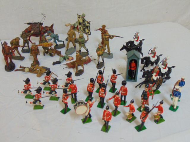Lot of toy soldier figures, WW2, Elastolin German & lot: Lot of toy soldier figures, WW2, Elastolin German & lot of hand painted English tin soldiers, Britain's LTD, German soldiers include German soldier carrying flag with iron cross & swastika.