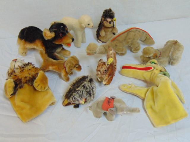 12 small Steiff animals,3 dogs, dinosaur, Joggi the: 12 small Steiff animals,3 dogs, dinosaur, Joggi the hedgehog, 2 hand puppets (crocodile & lion), seated hedgehog, lamb, small elephant, mole & Perri the squirrel.
