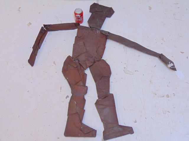 Copper figural sculpture, unsigned, sectional 2: Copper figural sculpture, unsigned, sectional 2 dimensional sculpture of a man with cap, boots, copper segments held together with steel wire, height is 41"