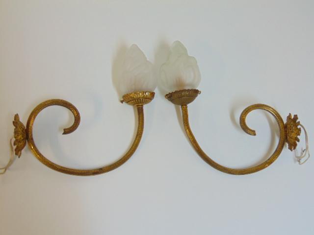Pair of brass wall sconces with art glass shades, each: Pair of brass wall sconces with art glass shades, each sconce is 11.5" tall including the shade, distance from wall is 10.5"