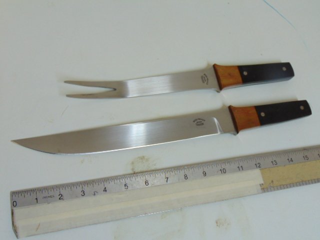 Large Bud Nealy serving fork & knife: Large Bud Nealy serving fork & knife, brass & wood handle, blade on knife is 11 1/8"