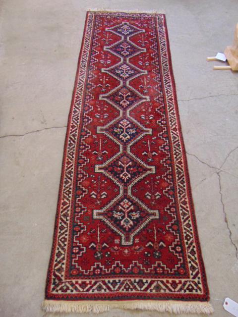 Caucasian runner, in red, runner is 97" by 31" (1 of 5)