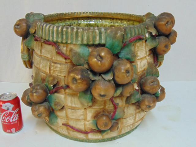 Large amphora apple basket planter, ceramic planter in: Large amphora apple basket planter, ceramic planter in basket form with applied apples to exterior, some chips, cracked, 19" wide, height is 14.5". Notice: Please note that our auctions will continue 