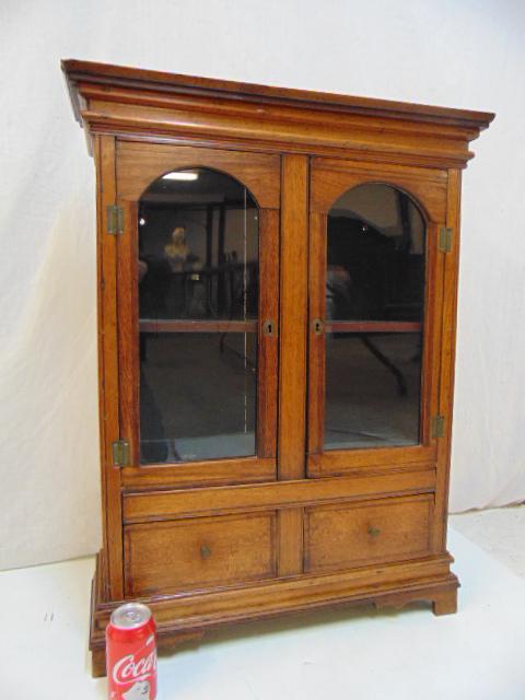 Antique miniature wall cupboard, double door over two: Antique miniature wall cupboard, double door over two drawers, inlaid walnut, exceptional quality, early 19th Century, cabinet is 25.75" by 8", height is 33". Notice: Please note that our auctions wil