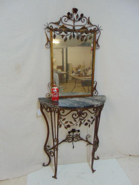 Iron marble top console with mirror, paint decorated,: Iron marble top console with mirror, paint decorated, applied flowers, black marble top, 27" by 11", height, including mirror is 61.5", marble has chipped corners on both sides. Notice: Please note th