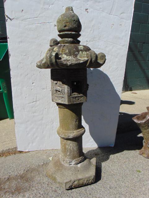 Japanese carved stone pagoda lantern, sectional, height: Japanese carved stone pagoda Kasuga lantern, sectional, height is 49.5", top finial is chipped, one side ornament is broken off.
