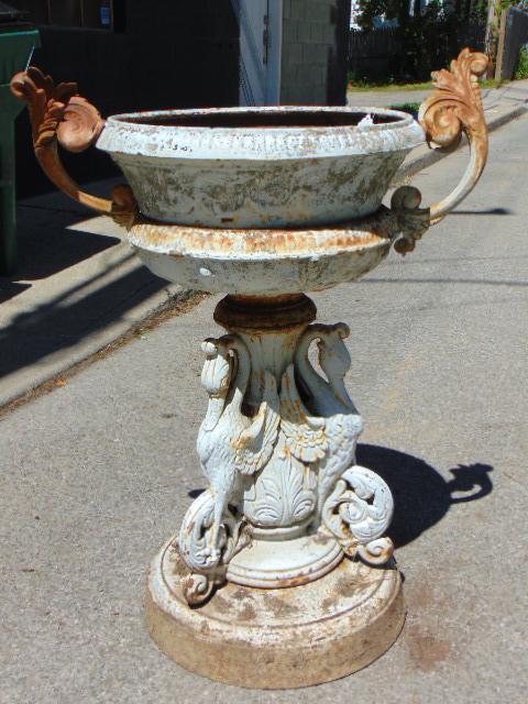 Antique cast iron garden urn with swan base, sectional,: Antique cast iron garden urn with swan base, sectional, with handles, one handle broken, urn is 23" in diameter excluding handles, height is 37.5"