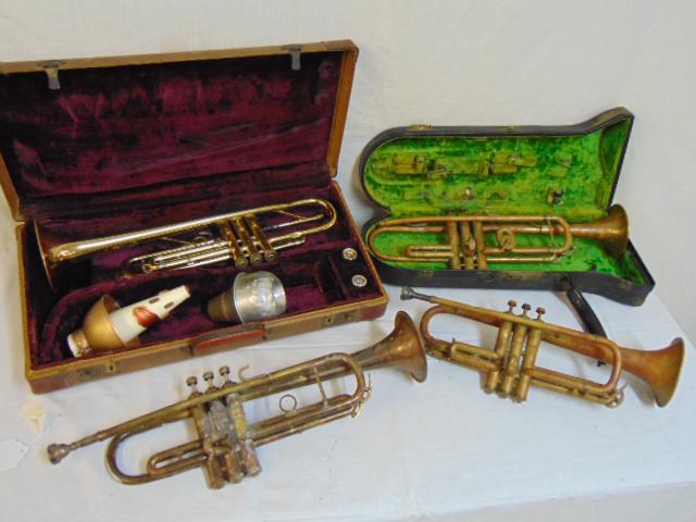4 vintage trumpets, Mersel American from Lelmer, New: 4 vintage trumpets, Mersel American from Lelmer, New York in brass plus unsigned, two in case, dented, sold as is