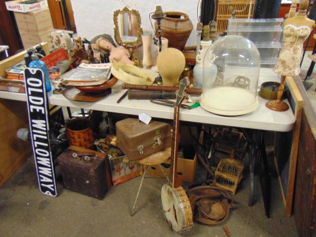 Large table lot lighting; vintage street signs;: Large table lot lighting; vintage street signs; Victorian glass dome; banjo; African basket; cast iron mirror; slate board; sheriff sign; bird cages fireman, etc. Note, table lots and large group lots