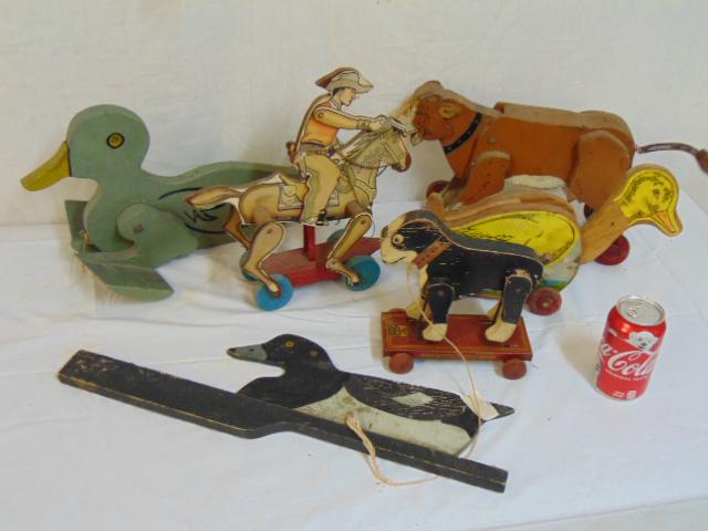Vintage wood pull toy lot, various animals, paint: Vintage wood pull toy lot, various animals, paint decorated & paper applied decoration, duck, cowboy on horseback, dog, cow.