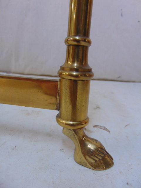 Brass base glass top coffee table, oval table with hoof: Brass base glass top coffee table, oval table with hoof feet, stretcher base, table is 51.5" by 26.25", height is 15"