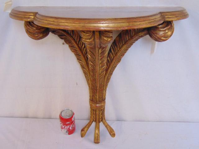 Plume parcel gilt shelf, console, top is 23.25" by: Plume parcel gilt shelf, console, top is 23.25" by 11.5", height is 22.5", made in Italy.