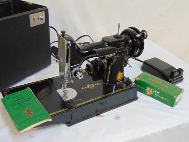 Singer featherweight sewing machine, 221, all original,: Singer featherweight sewing machine, 221, all original, in case, in exceptional "like new" condition, with accessories..UPDATE: Tried running it, did not move, light does come on, inspected the wiring