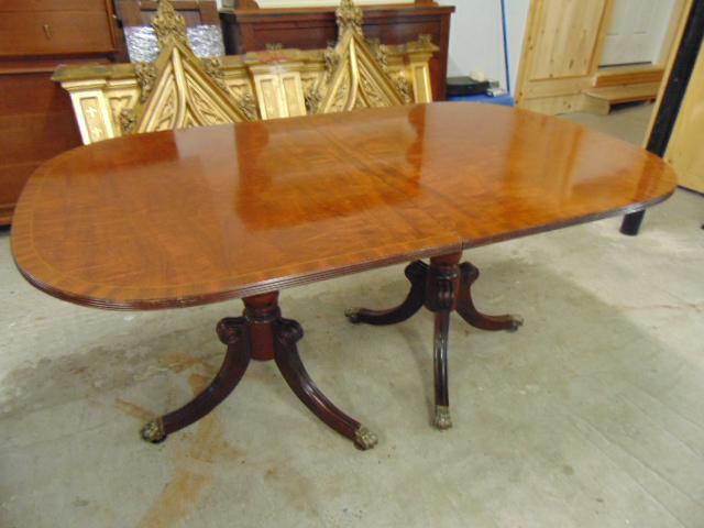 Schmieg & Kotzian double pedestal table, inlaid: Schmieg & Kotzian double pedestal table, inlaid mahogany double pedestal dining table with 3 leaves, table is 64.5" by 40.5", height is 30.5", each leaf is 20" wide, in good condition.