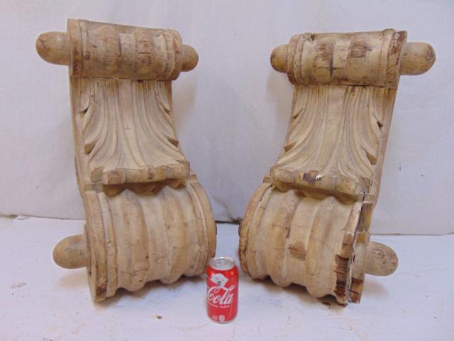 Pair carved wood corbels, architectural elements, with: Pair carved wood corbels, architectural elements, with decorative leaf carvings, some loss of molding, each bracket is 15.25" wide, 14" deep, height is 23"