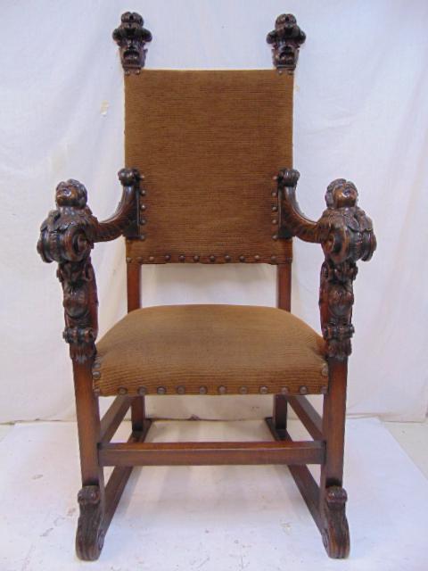 Italian renaissance revival throne chair, carved heads,: Italian renaissance revival throne chair, carved heads, upholstered seat & back.Chair is 29.5" wide, 29.5" deep (measured as base, ground level), height is 61.5", seat height is 22".