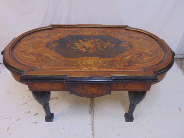 Victorian inlaid center table, ebonized, inlaid woods,: Victorian inlaid center table, ebonized, inlaid woods, decorated with floral scenes, birds, snakes, rake, top is 48.25" by 31", height is 20.5" (cut down)