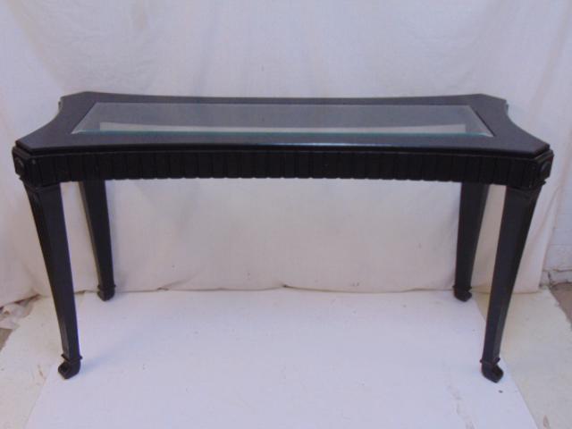 Glass top sofa table, black painted carved wood base,: Glass top sofa table, black painted carved wood base, table is 58" by 21", height is 32.25"
