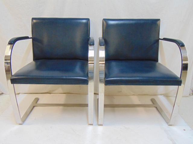 Pair Knoll BRNO steel & vinyl spring chairs, black /: Pair Knoll BRNO steel & vinyl spring chairs, black / dark blue vinyl and steel construction, with arm pads, labeled Knoll International, in good condition, no tears, each chair is 23" wide, 20" deep, 