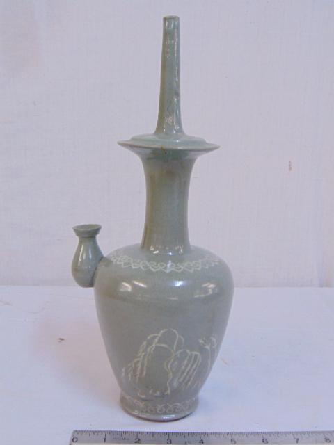 Korean Celadon water sprinkler bottle, ('kundika' or: Korean Celadon water sprinkler bottle, ('kundika' or 'chongbyong') for purifying the ground during Buddhist ceremonies, has repair, height is 13"