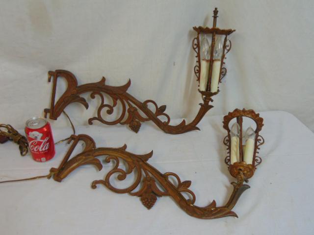 Pair swing arm wall sconces, decorated with grapes,: Pair swing arm wall sconces, decorated with grapes, each sconce is 21.5" long, note, no mounting brackets.