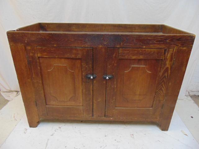 Oak dry sink, double door base, 19th century country: Oak dry sink, double door base, 19th century country dry sink, raised panel doors, top is 48" by 21", height is 32.75", interior in lined with old newspaper, Philadelphia Ledger, 1908