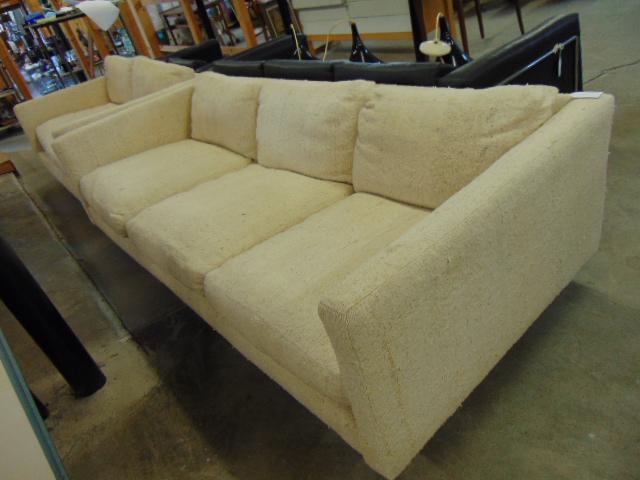 White upholstered MCM sofa & love seat, sofa is 83",: White upholstered MCM sofa & love seat, sofa is 83", loveseat is 60.5", depth is 37", Mid Century design.