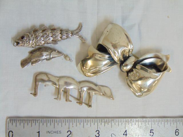 Sterling jewelry lot, 2 fish pendants, R. Nichols: Sterling jewelry lot, 2 fish pendants, R. Nichols sterling pin & Monet Sterling bow pin. 42.25 dwt