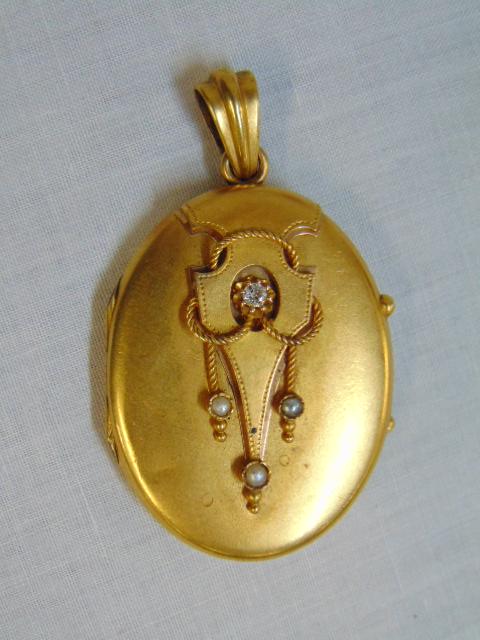 18k Art Deco gold locket, w/ small diamonds & sea: 18k Art Deco gold locket, w/ small diamonds & sea pearls, 11.3 grams, case has dings & dents, 1.5" by 1.25"