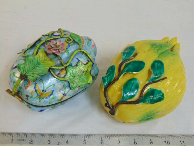 Enameled & silver covered box & Chinese porcelain hand: Enameled & silver covered box & Chinese porcelain hand of Buddha, silver enameled box is floral decorated, in light blue with applied flowers & leaves, 6.5" long, few small chips; hand of Buddha in ye
