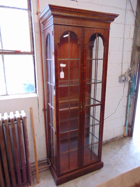 Double door display cabinet, with glass shelves &: Double door display cabinet, with glass shelves & lighting, cabinet is 32.25" by 17", height is 80.75"