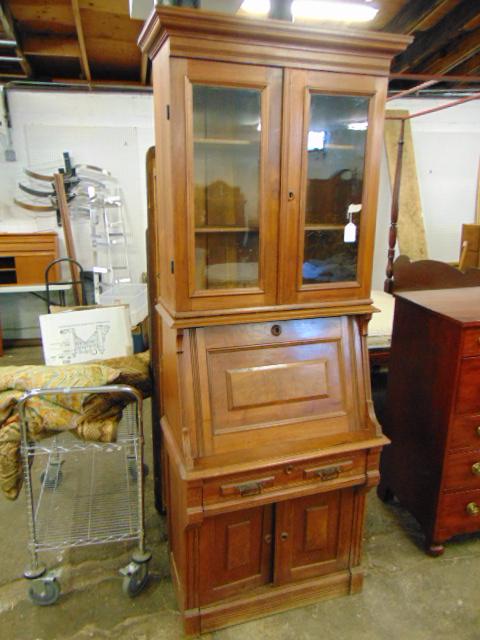 Victorian walnut secretary, sectional, with slant front: Victorian walnut secretary, sectional, with slant front desk area.Late 19th Century, some scratches, used condition, the width at the widest point ( below the slant) is 32", depth there is 18", height