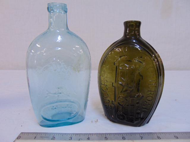 Early glass bottles, blue flask "For Pike's Peak" &: Early glass bottles, blue flask "For Pike's Peak" & green bottle "Success to the Railroad", 6.75" & 7.75", both in good condition.