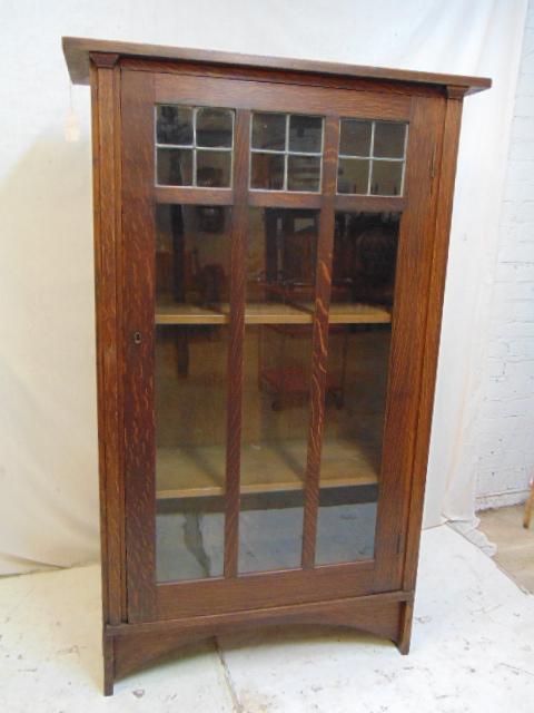 Gustav Stickley, Harvey Ellis single door: Gustav Stickley, Harvey Ellis single door bookcase, mission oak bookcase, wood shelves, leaded glass door, signed , 35 5/8" by 14", height is 57.75", no key, comes with 4 shelves, but only has shelf b