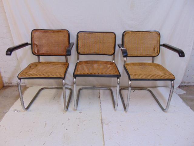 3 Marcel Breuer for Thonet caned chairs, 2 arm, one: 3 Marcel Breuer for Thonet caned chairs, 2 arm, one side, German made, caning is good, no damage, armchairs have original arm rests, tubular frames have scratches & some rust, need cleaning. Note, one