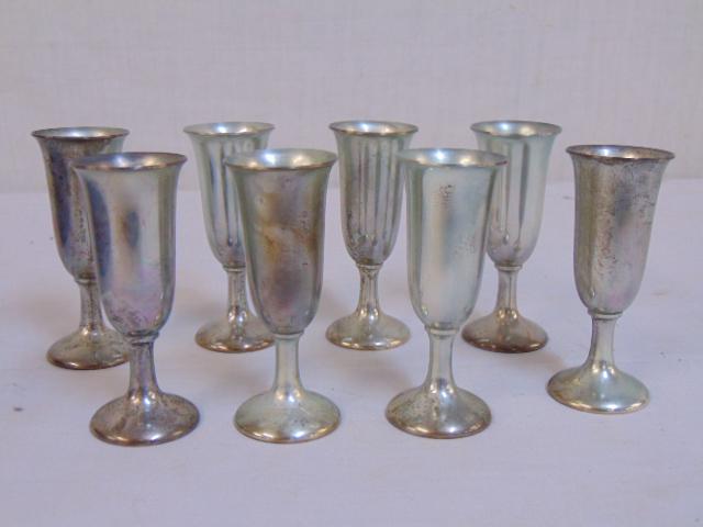 Set of 8 sterling silver cups by Cartier, 8 troy, each: Set of 8 sterling silver cups by Cartier, 8 troy, each cup is 3.25" tall.