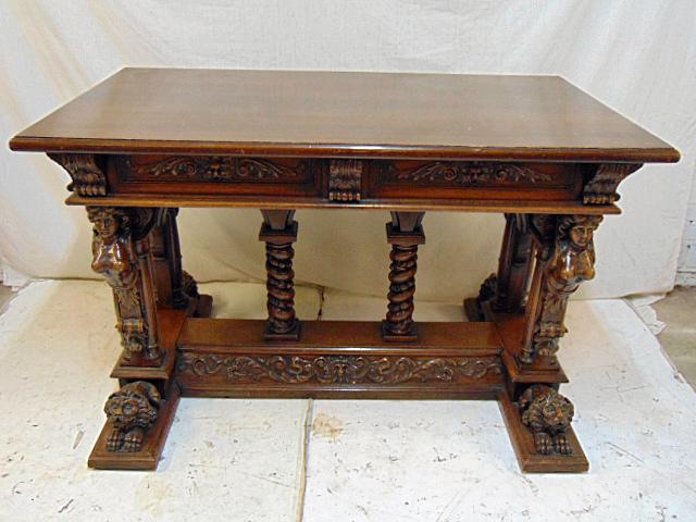 Renaissance Revival table with carved lions, winged: Renaissance Revival table with carved lions, winged figures & carved base, table is 47.25" by 27.5", height is 30", some scratches on top.