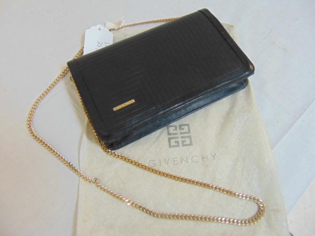 Vintage designer handbag, by Givenchy, in black leather: Vintage designer handbag, by Givenchy, in black leather with gold toned chain, in good condition.