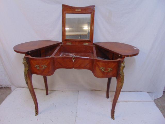 French dressing table, fold out sides, mirror in: French dressing table, fold out sides, mirror in center, bronze mounted, some veneer loss, vanity is 18.5" by 42.5" (kidney shaped top), height is 30"