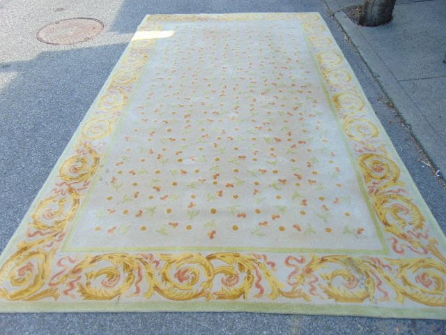 Roomsize rug by Stark Studio: Roomsize rug by Stark, made in Hong Kong, 10' by 13'6", yellow field, some stains (see images)