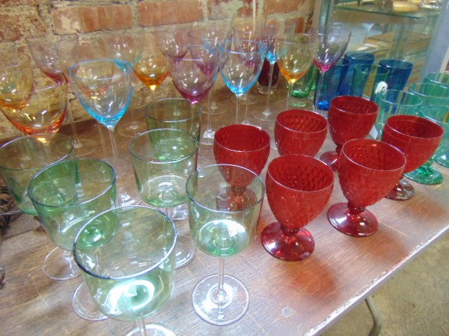 Lot colored stemware, Villeroy & Boch: Lot colored stemware, Villeroy & Boch, includes 18 multi colored wine glasses with stem feet , 6 green water glasses, 8 glasses, 6 red glasses, 6 green wine glasses with clear stems & large single cle