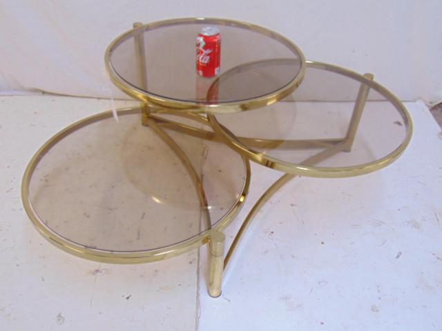 Milo Baughman brass base triple round coffee table,: Milo Baughman brass base triple round coffee table, table has three tiered tops that swing out, each round top is 24", height is 16.5"