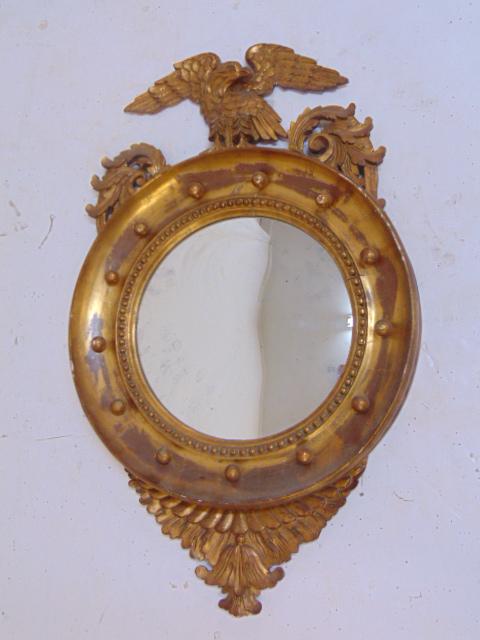 Gilt bull's-eye mirror with eagle, 1930's, height: Gilt bull's-eye mirror with eagle, 1930's, height mirror is 33.5" tall, 20" wide, eagle is loose.