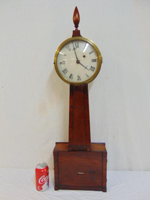 Antique Banjo clock, mahogany case, painted dial, wood: Antique Banjo clock, mahogany case, painted dial, wood finial, clock is 33 1/4" tall with pendulum & weight